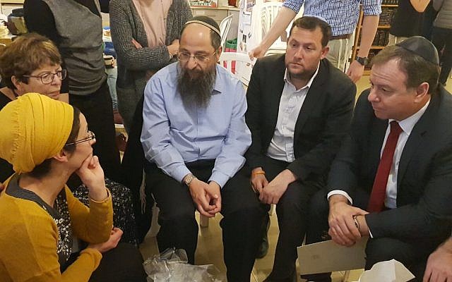 Prime Minister Benjamin Netanyahu's Chief of Staff Yoav Horovitz (R) pays a condolence visit to Miriam Ben Gal, whose husband was killed in a terror attack on February 11, 2018. (courtesy) Prime Minister Benjamin Netanyahu's Chief of Staff Yoav Horovitz (R) pays a condolence visit to Miriam Ben Gal, whose husband was killed in a terror attack on February 11, 2018. (courtesy)