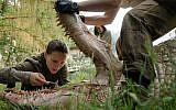 Natalie Portman tinkers with a mutant crocodile in 'Annihilation.' (Paramount Pictures)