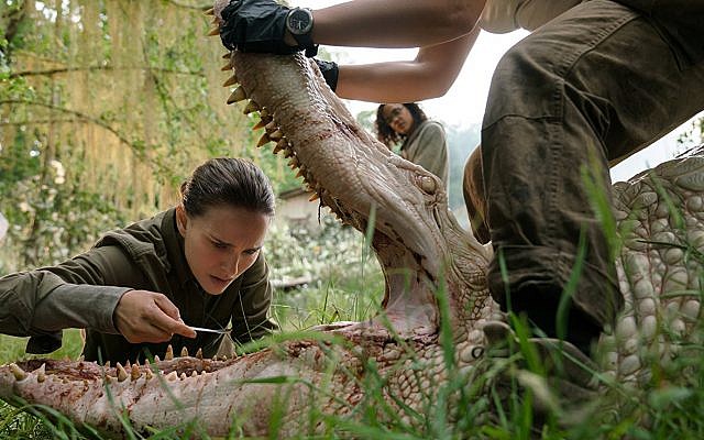 Natalie Portman tinkers with a mutant crocodile in 'Annihilation.' (Paramount Pictures)
