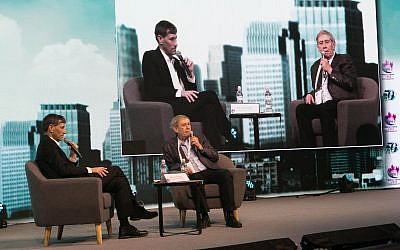 Photo of Tamir Pardo, right, former director of Mossad, speaking to attendees at The Federation of Local Authorities second bi-annual conference at the Tel Aviv convention center on Feb 13. (Courtesy)