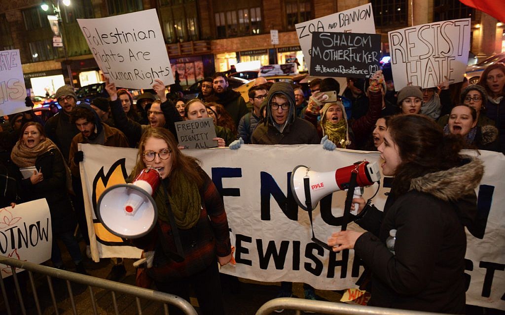 Naomi Hornstein (left) and Molly Schulman holding megaphones at an If Not Now protest outside the Zionist Organization of America gala in New York City. (Gili Getz)