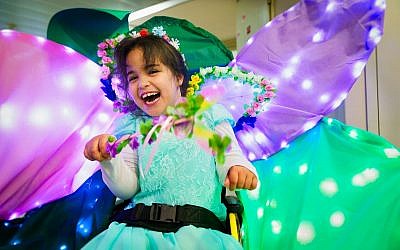 Yarden, a pleased fairy in her sparkling costumed wheelchair at Beit Issie Shapiro (Courtesy Beit Issie Shapiro)
