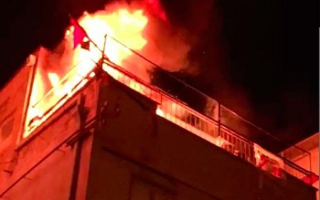A fire breaks out in the Balad faction headquarters in Tel Aviv on January 31, 2018. (Screen capture/Omri Barens)