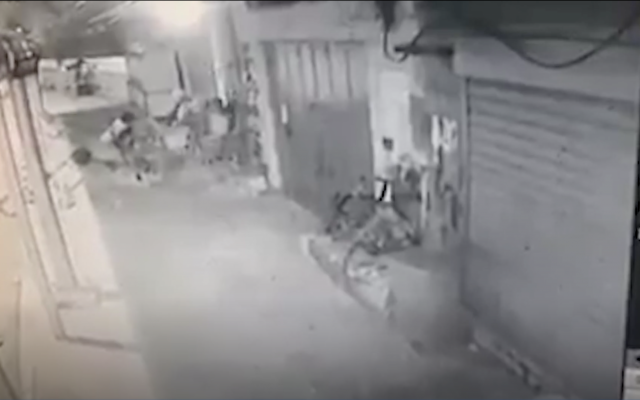 Soldiers arrest a Palestinian assailant who ran at one of them with a table during a riot in the West Bank city of Jericho on February 22, 2018. (Screen capture) Soldiers arrest a Palestinian assailant who ran at one of them with a table during a riot in the West Bank city of Jericho on February 22, 2018. (Screen capture)