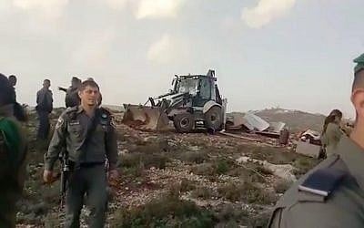 Border Police raze three makeshift homes in the Geulat Tzion illegal outpost in the central West Bank, on February 26, 2018. (Screen capture/YouTube)