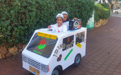 Two kids from Kiryat Gat dress up for Purim as Na Nachs, Breslov Hasidim who often travel around in white vans, dancing in the streets to techno music (Courtesy Facebook)