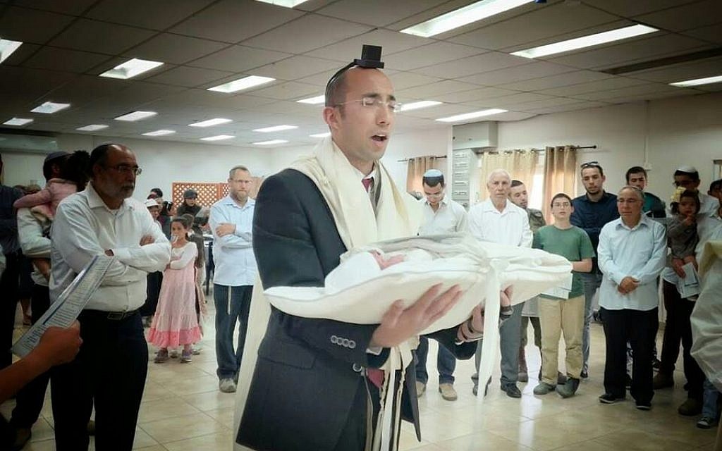 Itamar Ben-Gal, who was killed in a stabbing attack in the West Bank, February 5, 2018, pictured here at the circumcision of his son in 2017 (Yitzhak Melamed) Itamar Ben-Gal, who was killed in a stabbing attack in the West Bank, February 5, 2018, pictured here at the circumcision of his son in 2017 (Yitzhak Melamed)