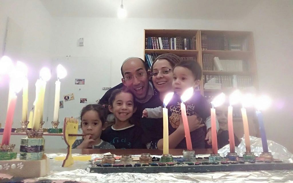 Itamar Ben-Gal (third from L), who was murdered by a Palestinian terrorist on February 5, 2018, pictured with his family celebrating Hannukah in 2017. (Courtesy) Itamar Ben-Gal (third from L), who was murdered by a Palestinian terrorist on February 5, 2018, pictured with his family celebrating Hannukah in 2017. (Courtesy)