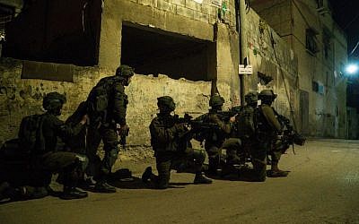 Illustrative: IDF soldiers search for the perpetrators of the terror attack that killed Rabbi Raziel Shevach in the northern West Bank village of Burqin, on February 4, 2017. (IDF spokesperson)