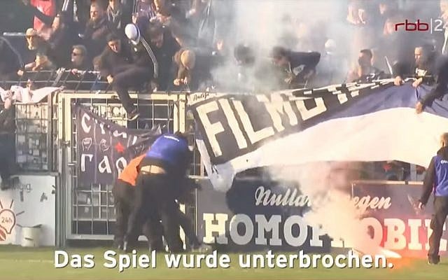 Security guards clash with Cottbus fans during a soccer match between SV Babelsberg and Energie Cottbus in Babelsberg, eastern Germany, on April 28, 2018. (YouTube screen capture) Security guards clash with Cottbus fans during a soccer match between SV Babelsberg and Energie Cottbus in Babelsberg, eastern Germany, on April 28, 2018. (YouTube screen capture)
