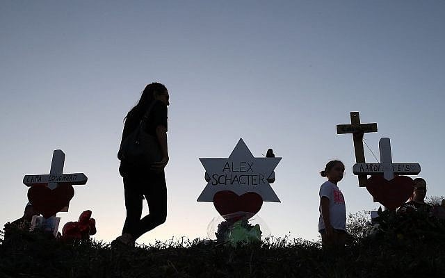 A makeshift memorial erected in front of Marjory Stoneman Douglas High School in Parkland, Florida, days after the shooting that left 17 students and teachers dead, February 18, 2018. (Joe Raedle/Getty Images via JTA) A makeshift memorial erected in front of Marjory Stoneman Douglas High School in Parkland, Florida, days after the shooting that left 17 students and teachers dead, February 18, 2018. (Joe Raedle/Getty Images via JTA)