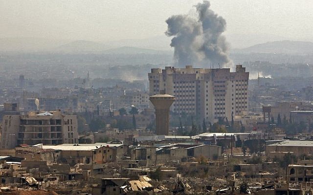 A picture taken from a government-controlled area on the outskirts of Harasta on the northeastern suburbs of Damascus on February 21, 2018, shows smoke rising from areas targeted by Syrian army shelling in the towns of Arbin and Harasta. (AFP PHOTO) A picture taken from a government-controlled area on the outskirts of Harasta on the northeastern suburbs of Damascus on February 21, 2018, shows smoke rising from areas targeted by Syrian army shelling in the towns of Arbin and Harasta. (AFP PHOTO)