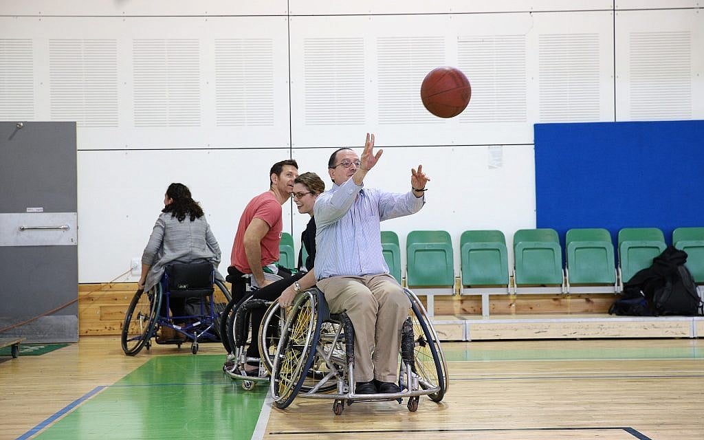 CEO of the American Jewish Joint Distribution Committee (JDC) David M. Schizer at the Spivack gymnasium in Ramat Gan, playing basketball as part of the Israel Unlimited partnership with the Ruderman Family Foundation and Israeli government to empower Israelis with disabilities, February 2018. (JDC) CEO of the American Jewish Joint Distribution Committee (JDC) David M. Schizer at the Spivack gymnasium in Ramat Gan, playing basketball as part of the Israel Unlimited partnership with the Ruderman Family Foundation and Israeli government to empower Israelis with disabilities, February 2018. (JDC)