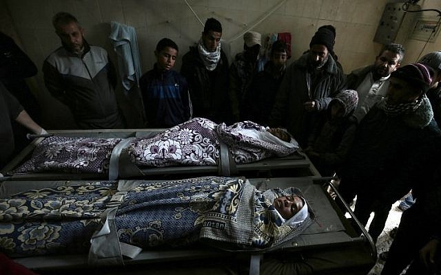 Palestinian relatives mourn over the bodies of Salam Sabah (L) and Abdullah Abu Sheikha (R), both 17, during their funeral, in Rafah in the southern Gaza Strip on February 18, 2018. Two Palestinians were killed by Israeli fire, Gaza medical sources said, after four soldiers were wounded in bomb attack on the border with the Palestinian enclave. (AFP PHOTO / SAID KHATIB) Palestinian relatives mourn over the bodies of Salam Sabah (L) and Abdullah Abu Sheikha (R), both 17, during their funeral, in Rafah in the southern Gaza Strip on February 18, 2018. Two Palestinians were killed by Israeli fire, Gaza medical sources said, after four soldiers were wounded in bomb attack on the border with the Palestinian enclave. (AFP PHOTO / SAID KHATIB)