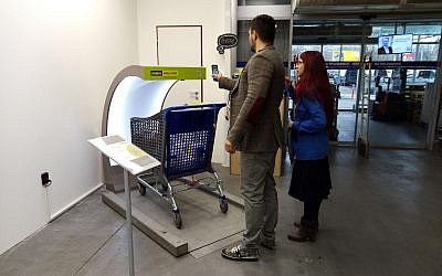 Photo of shoppers in Prague using Supersmart technology at a grocery store. (Courtesy)