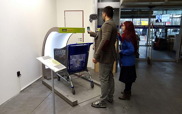 Photo of shoppers in Prague using Supersmart technology at a grocery store. (Courtesy)