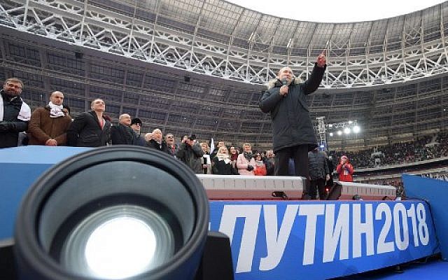 Presidential candidate, President Vladimir Putin gives a speech during a rally to support his candidature in the upcoming presidential election at the Luzhniki stadium in Moscow on March 3, 2018. (AFP PHOTO / SPUTNIK / Alexey DRUZHININ) Presidential candidate, President Vladimir Putin gives a speech during a rally to support his candidature in the upcoming presidential election at the Luzhniki stadium in Moscow on March 3, 2018. (AFP PHOTO / SPUTNIK / Alexey DRUZHININ)