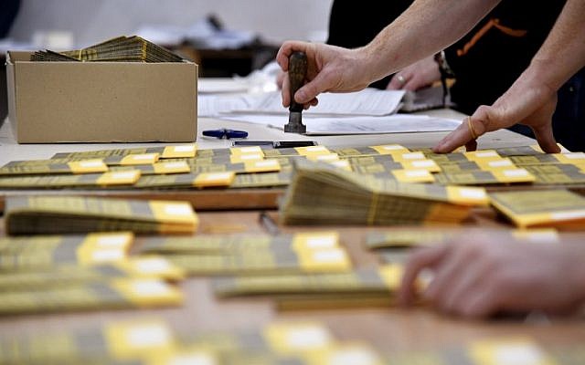 People prepare ballots at a polling station in downtown Rome on March 3, 2018.
Italians vote on March 4 in one of the country's most uncertain elections, with far-right and populist parties expected to make major gains and Silvio Berlusconi set to play a leading role. (AFP/Andreas SOLARO) People prepare ballots at a polling station in downtown Rome on March 3, 2018.
Italians vote on March 4 in one of the country's most uncertain elections, with far-right and populist parties expected to make major gains and Silvio Berlusconi set to play a leading role. (AFP/Andreas SOLARO)