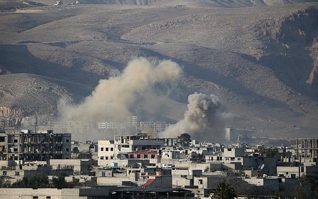 Smoke billows following Syrian government bombardments on the besieged rebel-held town of Hamouria in the eastern Ghouta region on the outskirts of the capital Damascus on March 3, 2018.  (AFP PHOTO / ABDULMONAM EASSA)