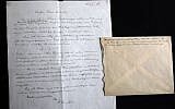 A picture taken on March 6, 2018 shows a signed letter by Nobel Prize-winning physicist Albert Einstein dated 1928 concerning the formalization of the "Third Stage of the Theory of Relativity" on display at Winner's auction house in Jerusalem, prior to being auctioned later in the night with the rest of a series of nine. (AFP PHOTO / MENAHEM KAHANA)