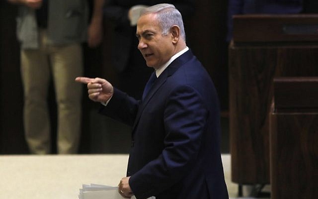 Prime Minister Benjamin Netanyahu gestures during a Knesset plenum session on March 12, 2018. (AFP Photo/Menahem Kahana) Prime Minister Benjamin Netanyahu gestures during a Knesset plenum session on March 12, 2018. (AFP Photo/Menahem Kahana)