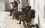 Israeli paratroopers and US soldiers from the 2nd Battalion, 6th Marine Regiment take part in training during the joint Israeli-US military Juniper Cobra exercise at the Tzeelim urban warfare training center in southern Israel on March 12, 2018. (Jack Guez/AFP)