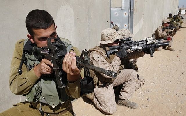 Israeli paratroopers and US soldiers from the 2nd Battalion, 6th Marine Regiment take part in training during the joint Israeli-US military Juniper Cobra exercise at the Tzeelim urban warfare training center in southern Israel on March 12, 2018. (Jack Guez/AFP) Israeli paratroopers and US soldiers from the 2nd Battalion, 6th Marine Regiment take part in training during the joint Israeli-US military Juniper Cobra exercise at the Tzeelim urban warfare training center in southern Israel on March 12, 2018. (Jack Guez/AFP)