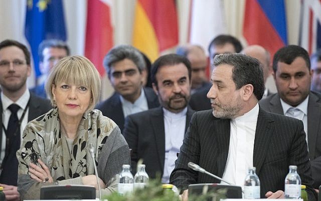 Abbas Araghchi (R), political deputy at the Ministry of Foreign Affairs of Iran, and the Secretary General of the European Union External Action Service (EEAS) Helga Schmid attend E3/EU+3 and Iran talks at Palais Coburg in Vienna, Austria on March 16, 2018. (AFP/Joe Klamar) Abbas Araghchi (R), political deputy at the Ministry of Foreign Affairs of Iran, and the Secretary General of the European Union External Action Service (EEAS) Helga Schmid attend E3/EU+3 and Iran talks at Palais Coburg in Vienna, Austria on March 16, 2018. (AFP/Joe Klamar)