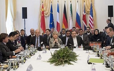 Abbas Araghchi (C-R), political deputy at the Ministry of Foreign Affairs of Iran, and the Secretary General of the European Union External Action Service (EEAS) Helga Schmid (C-L) along with delegates attend E3/EU+3 and Iran talks at Palais Coburg in Vienna, Austria on March 16, 2018. (AFP PHOTO / JOE KLAMAR)