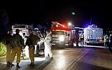 Israeli security forces and forensics experts at the site of a car-ramming attack on Israeli soldiers near the West Bank settlement of Mevo Dotan on March 16, 2018. (AFP Photo/Jack Guez)