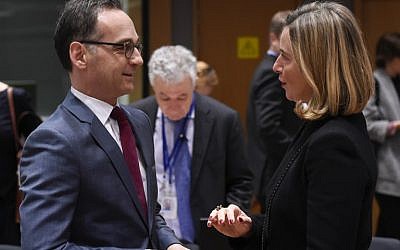German Minister of Foreign Affairs Heiko Maas, left, speaks with High Representative of the Union for Foreign Affairs and Security Policy Federica Mogherini ahead of a Foreign Affairs minister meeting at EU headquarters in Brussels on March 19, 2018. (AFP/JOHN THYS)