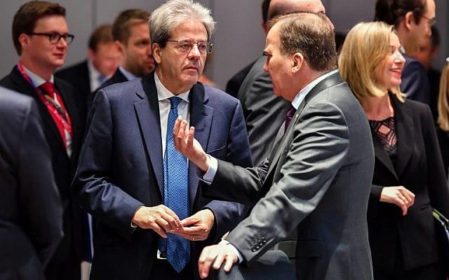 Italy's Prime Minister Paolo Gentiloni (L) talks with Sweden's Prime Minister Stefan Lofven on the second day of a summit of European Union leaders at the European Council headquarter in Brussels, on March 23, 2018. (AFP PHOTO / POOL / Geert Vanden Wijngaert) Italy's Prime Minister Paolo Gentiloni (L) talks with Sweden's Prime Minister Stefan Lofven on the second day of a summit of European Union leaders at the European Council headquarter in Brussels, on March 23, 2018. (AFP PHOTO / POOL / Geert Vanden Wijngaert)