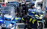 French National Gendarmerie Intervention Group troops and gendarmes gather outside the Super U supermarket in the town of Trebes, southwestern France, where a terrorist took hostages before he was killed by security forces on March 23, 2018. (AFP Photo/Eric Cabanis)