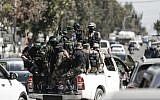 Hamas fighters take part in a military maneuver in Gaza City on March 25, 2018. (AFP Photo/Mahmud Hams)