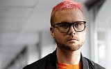 Canadian data analytics expert and whistle-blower, Christopher Wylie poses for photographs outside a press conference in London on March 26, 2018.  (AFP PHOTO / Tolga AKMEN)