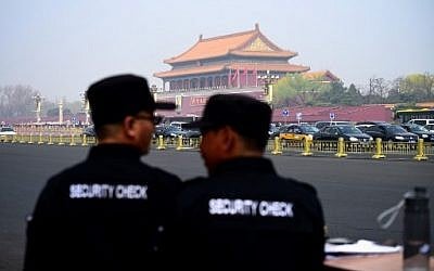 Two security guards watch near the Tiananmen Square in Beijing on March 27, 2018. Speculation intensified on March 27, 2018 that North Korean leader Kim Jong-Un was in Beijing for a surprise visit, after Japanese media reported the arrival of a special North Korean train met by an honour guard under tight security. ( AFP PHOTO / WANG ZHAO)
