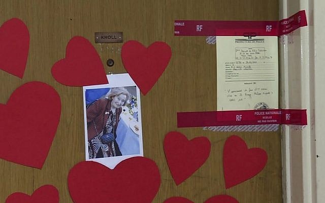 This AFP TV video frame grab shows a picture of Mireille Knoll, heart-shaped papers and police seals posted on the door of her apartment in Paris, March 27, 2018. (Laetitia PERON) This AFP TV video frame grab shows a picture of Mireille Knoll, heart-shaped papers and police seals posted on the door of her apartment in Paris, March 27, 2018. (Laetitia PERON)