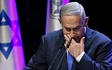 Prime Minister Benjamin Netanyahu coughing while addressing an annual health conference in Tel Aviv on March 27, 2018.  (AFP / JACK GUEZ)