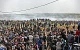 A picture taken on March 30, 2018 shows Palestinians taking part in a demonstration commemorating Land Day near the border with Israel east of Gaza City. (AFP/Mahmud Hams)