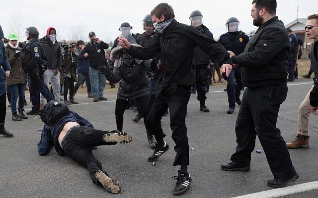 White nationalists clash with counter-demonstrators before the start of a speech by white nationalist Richard Spencer, who popularized the term 'alt-right', at Michigan State University on March 5, 2018, in East Lansing, Michigan. (Scott Olson/Getty Images/ AFP)