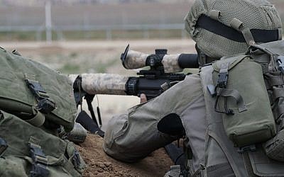 Illustrative: Israeli snipers prepare for massive protests by Palestinians in Gaza and the potential for demonstrators to try to breach the security fence on March 30, 2018. (Israel Defense Forces/File)