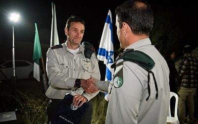 Illustrative: Military Intelligence chief Maj. Gen. Herzl Halevi awards the commander of Unit 504 with an official commendation in March 2018. For security reasons, the commander's identity is classified. (Israel Defense Forces)