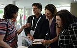 Dr. Nancy Strichman discussing her findings with attendees. (Gal Mosenson)