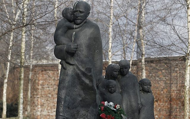 Illustrative: Flowers are placed at the memorial to Janusz Korczak who died in the gas chamber of the Treblinka Nazi German death camp in 1942 together with the children of the Jewish orphanage that he ran in the Warsaw Ghetto, at the Jewish cemetery in Warsaw, Poland, Thursday, March 1, 2018. (AP Photo/Czarek Sokolowski) Illustrative: Flowers are placed at the memorial to Janusz Korczak who died in the gas chamber of the Treblinka Nazi German death camp in 1942 together with the children of the Jewish orphanage that he ran in the Warsaw Ghetto, at the Jewish cemetery in Warsaw, Poland, Thursday, March 1, 2018. (AP Photo/Czarek Sokolowski)