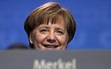 German Chancellor and party chairwoman Angela Merkel smiles at the party convention of the Christian Democratic Union in Berlin on February 26, 2018. (AP Photo/Markus Schreiber, file)