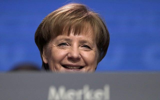 German Chancellor and party chairwoman Angela Merkel smiles at the party convention of the Christian Democratic Union in Berlin on February 26, 2018. (AP Photo/Markus Schreiber, file) German Chancellor and party chairwoman Angela Merkel smiles at the party convention of the Christian Democratic Union in Berlin on February 26, 2018. (AP Photo/Markus Schreiber, file)