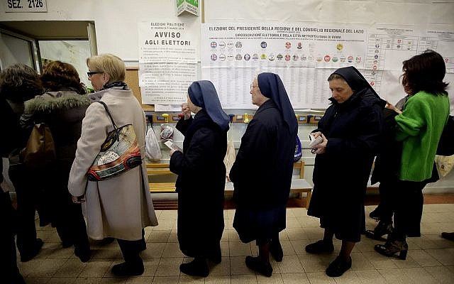 People line up at a polling station near the Vatican, in Rome, Sunday, March 4, 2018. (AP Photo/Alessandra Tarantino) People line up at a polling station near the Vatican, in Rome, Sunday, March 4, 2018. (AP Photo/Alessandra Tarantino)