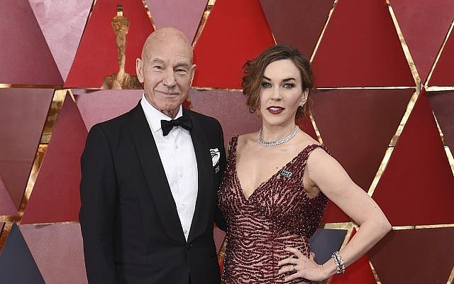 Patrick Stewart, left, and Sunny Ozell arrive at the Oscars on Sunday, March 4, 2018, at the Dolby Theatre in Los Angeles. (Richard Shotwell/Invision/AP)