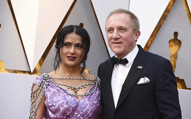 Salma Hayek, left, and Francois-Henri Pinault arrive at the Oscars on Sunday, March 4, 2018, at the Dolby Theatre in Los Angeles. (Jordan Strauss/Invision/AP)