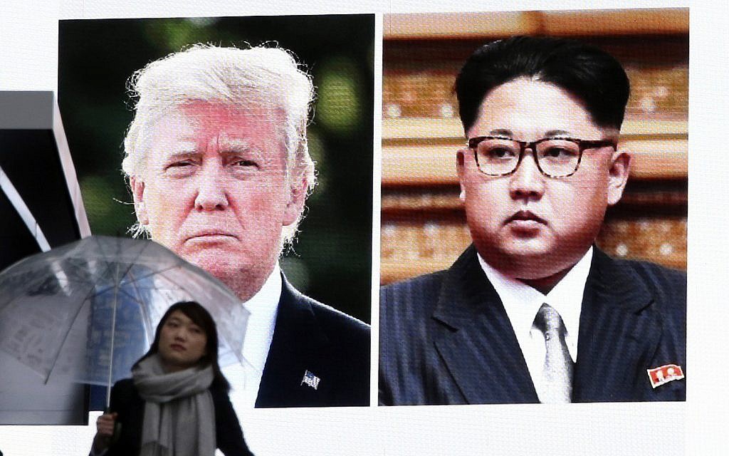 A woman walks by a huge screen showing US President Donald Trump, left, and North Korea's leader Kim Jong Un, in Tokyo, Friday, March 9, 2018. (AP Photo/Koji Sasahara) A woman walks by a huge screen showing US President Donald Trump, left, and North Korea's leader Kim Jong Un, in Tokyo, Friday, March 9, 2018. (AP Photo/Koji Sasahara)